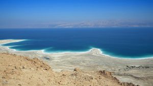 A picture taken on February 8, 2014 near Ein Gedi, in Israel shows the Dead Sea shoreline shaped by the decline in water levels as a result of the drying up. The Dead Sea, 400 meters below sea level, is the lowest point on earth and its mineral-rich waters and shores have been celebrated for their cleansing, healing and therapeutic properties. In the background is the Jordanian coast.   AFP PHOTO  THOMAS COEX        (Photo credit should read THOMAS COEX/AFP/Getty Images)